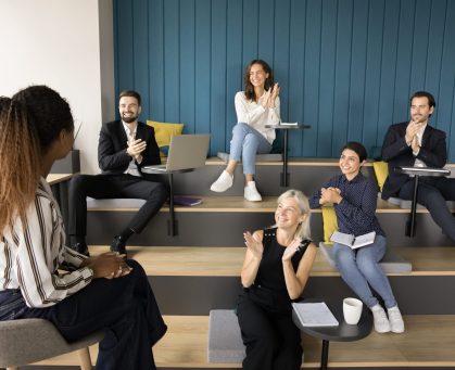 Diverse,Group,Applauding,Young,African,American,Presenter,Woman,,Clapping,Hands,